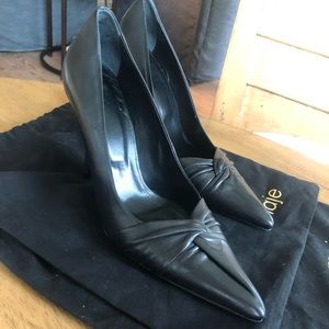 Black leather Maje heels with pointed toe and twist of leather